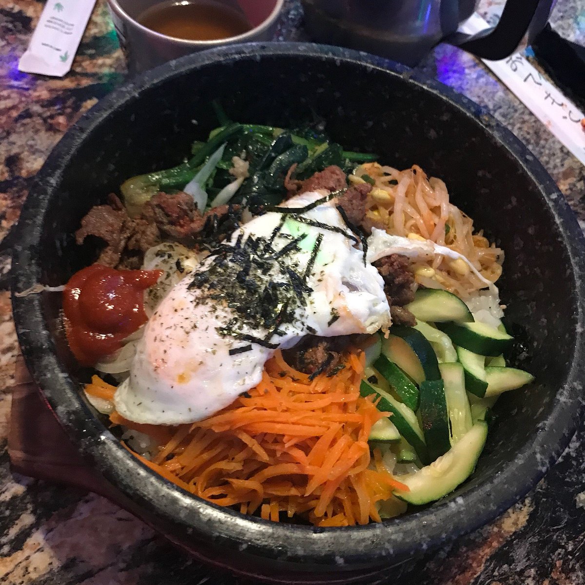 Gangnam Korean Cuisine signature dishes Bibimbap (Mixed Rice Bowl)Bulgogi (Marinated Beef)Kimchi Jjigae (Kimchi Stew)Galbi (Beef Short Ribs)